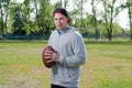 Young athlete holding a football ball