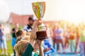 Young Athlete Holding Trophy. Youth Sport Soccer Team with Trophy Royalty Free Stock Photo