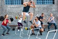 Young athlete jumping over hurdles Royalty Free Stock Photo