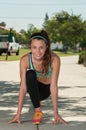 Young athlete lunging forward to stretch