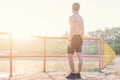 Young athlete man is looking out at sunset. Royalty Free Stock Photo