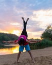 Young athletes doing acrobatic yoga exercises