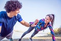 Young athletes giving high five to each other while doing push u Royalty Free Stock Photo