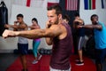 Young athletes practicing boxing against flags Royalty Free Stock Photo