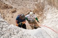 Young athletes start pair downhill using snapping gear in the mountains of the Judean Desert near the Tamarim stream near