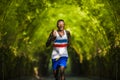 Young athletic and attractive black afro American runner man doing running workout training outdoors on urban city park in fitness Royalty Free Stock Photo