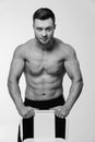 Young athletic bodybuilder. Strong muscular man black and white. Royalty Free Stock Photo