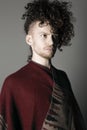 Young athletic ginger man in pancho studio portrait Royalty Free Stock Photo