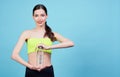 Young athletic girl in headphones with a bottle of water Royalty Free Stock Photo