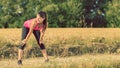 Young athletic girl stretching before jogging