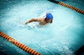 Young athletic man with butterfly swimming Royalty Free Stock Photo