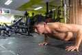 Young athletic man doing push-ups. Muscular and strong guy exercising Royalty Free Stock Photo