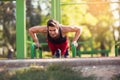 Young athletic man doing push ups outdoors. Royalty Free Stock Photo