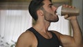 Young man drinking a smoothie drink or a protein shake Royalty Free Stock Photo