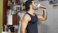 Young man drinking a smoothie drink or a protein shake Royalty Free Stock Photo