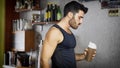 Young man drinking a smoothie drink or a protein shake Royalty Free Stock Photo