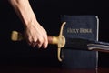 Young Athletic Man with His Bible and Sword Royalty Free Stock Photo