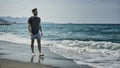 Young athletic man walking at the beach Royalty Free Stock Photo