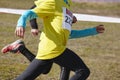 Young athletic runners on a race. Outdoor circuit