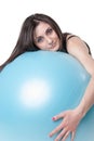 Young athletic woman exercised with a blue stability ball Royalty Free Stock Photo