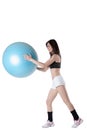 Young athletic woman exercised with a blue stability ball Royalty Free Stock Photo