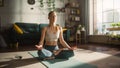 Young Athletic Woman Exercising, Practising Meditation in the Morning in Her Bright Sunny Home Royalty Free Stock Photo