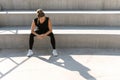 Young athletic woman and her shadow during summer workout Royalty Free Stock Photo