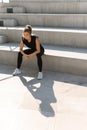 Young athletic woman and her shadow during summer workout Royalty Free Stock Photo