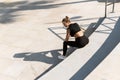 Young athletic woman and her shadow during summer workout Royalty Free Stock Photo