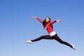 Young athletic woman jumping