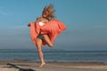 young athletic woman jumping and running on the beach Royalty Free Stock Photo