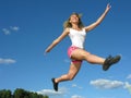 young athletic woman in a long jump Royalty Free Stock Photo