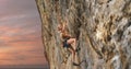 Young athletic woman rock climber climbing on the cliff Royalty Free Stock Photo