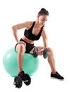 Young athletic woman working out with dumbbells Royalty Free Stock Photo