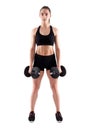 Young athletic woman working out with dumbbells Royalty Free Stock Photo