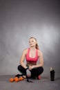 Young athletic woman works out with dumbbells