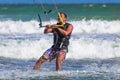 Young atletic man riding kite surf on a sea