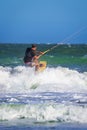 Young atletic man riding kite surf on a sea