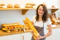 Young attarctive baker working at the bakery Royalty Free Stock Photo