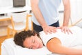 Young attarctive woman being manipulated by physiotherapist