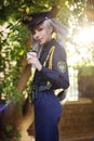 Young atteractive girl dressed as police oficer costume smiling