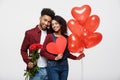 Young attractive african american couple on dating with red rose,heart and balloon. Royalty Free Stock Photo