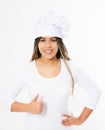 Young attractive african american woman in cooking hat with big thumb up isolated on white background. Copy space and mock up. Royalty Free Stock Photo
