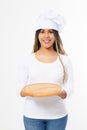 Young attractive african american woman in cooking hat holding empty wood pizza cutting board isolated on white background. Copy Royalty Free Stock Photo