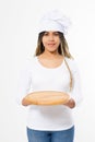 Young attractive african american woman in cooking hat holding empty wood pizza cutting board isolated on white background. Copy Royalty Free Stock Photo