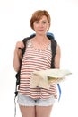 Young attractive American tourist woman with red hair holding city map carrying backpacker rucksack