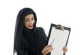 Young attractive arabic business woman showing clipboard