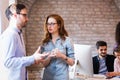 Young attractive architects discussing in modern office Royalty Free Stock Photo