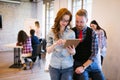 Young attractive architects discussing in modern office Royalty Free Stock Photo