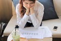 Young attractive Asian business woman analyzing charts or document files in her office. Selective focus and shallow depth of field Royalty Free Stock Photo